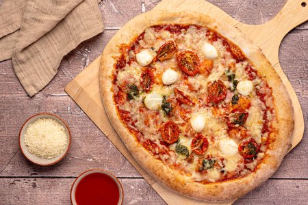 Photo for Food photography of pizza; mozzarella, dried, tomato, basil, pesto,; parmesan; cheese; tomato; sauce; oregano; spicy; background; meal; food - Royalty Free Image