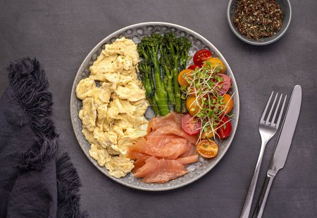 Photo for Food photography of breakfast, scrambled egg; brunch; omelette; smoked; salmon; broccoli, tomato, cress, salad, background - Royalty Free Image