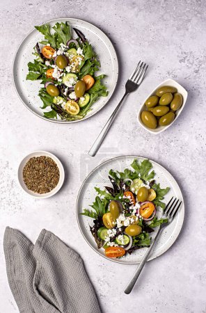 Photo for Food photography of salad; cheese manouri, feta; vegetable; tomato; cucumber; onion; lettuce; sauce; pepper; olive; seasoning - Royalty Free Image