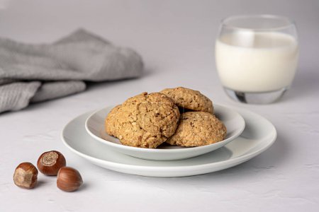Photo for Food photography of oat biscuit; oatmeal; cookie;nut; hazelnut, pastry, milk, glass, plate - Royalty Free Image