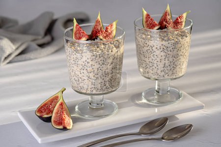 Food photography of oatmeal; oat; chia seeds; pudding; fig; yogurt; snack; brunch; breakfast; morning, healthy
