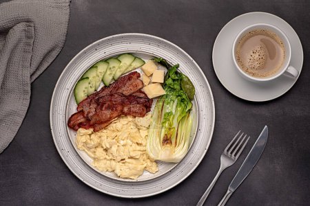 Photo for Food photography of breakfast; scrambled egg; fried bacon, cucumber, bok choi; cheese parmesan, keto diet; brunch;  background; - Royalty Free Image