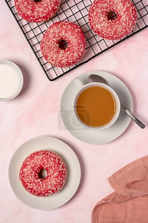 Photo for Food photography of donuts, glazed, tea, coffee, milk, bagel, bakery, baking, pastry, pink, treat, dessert, sprinkles, calories, icing, candy, - Royalty Free Image