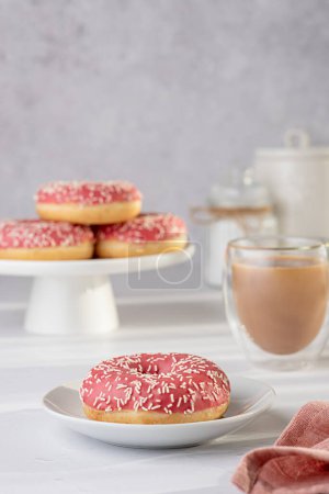Photo for Food photography of doughnut, donuts, glazed, tea, coffee, milk, bagel, bakery, baking, pastry, pink, treat, dessert, sprinkles, calories, icing, candy - Royalty Free Image