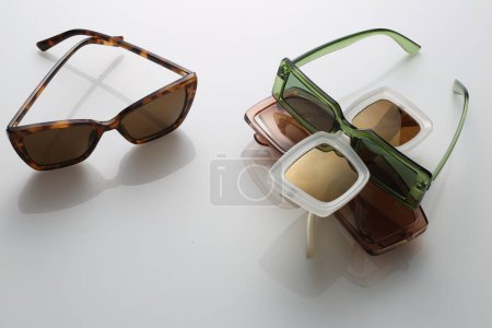 Photo for Colourful Sunglasses on a White Background - Product photography - Royalty Free Image