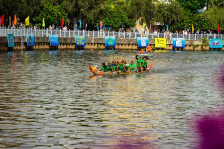 Photo for Ho Chi Minh, Viet Nam - 23 April 2023: Blurry motion of boat racing in the traditional Ngo boat racing festival of Khmer people - Royalty Free Image
