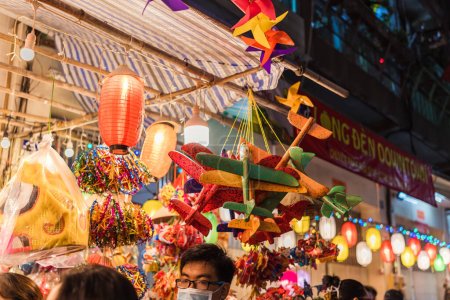 Photo for Ho Chi Minh City, Vietnam - Sep 1 2023: People visit and buy colorful traditional lanterns hanging on Luong Nhu Hoc Street, District 5 during the Mid-Autumn Festival. Fun and happy. Selective focus. - Royalty Free Image