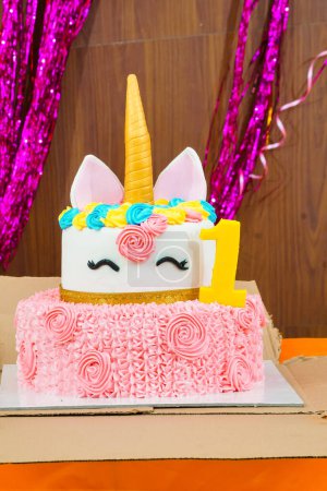 Photo for A beautiful and colorful unicorn cake perfect for a child's birthday party. The cake is made of white fondant and is decorated with a variety of colorful unicorn features - Royalty Free Image