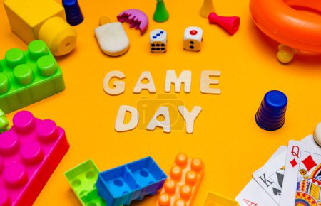 A photo of the letter "Game Day" spelled out with Scrabble game letters.