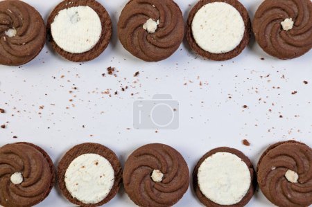 A close-up photo of two delectable chocolate cookies with a rich, creamy filling