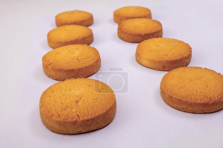 A close-up view of delicious cookies arranged on a clean white background, with a shallow depth of field