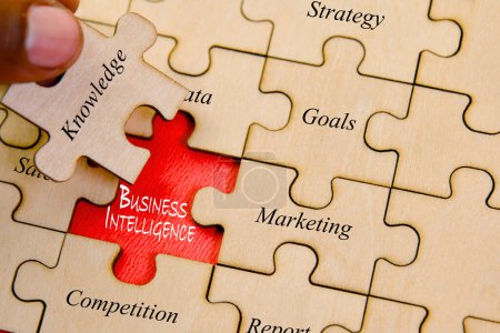 Photo for A close-up of a puzzle piece featuring the words "Business Intelligence," symbolizing the essential role - Royalty Free Image