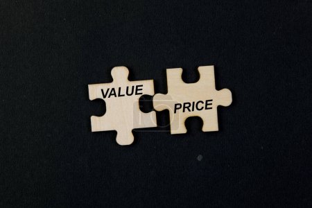 Disconnected jigsaw puzzle pieces coming together to form the words "VALUE" and "PRICE"