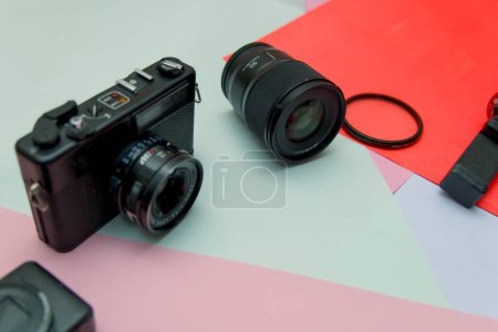 This image is about Photographer equipment on colorful background side view with copy space
