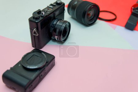 This image is about An Photographer equipment on colorful background side view with copy space