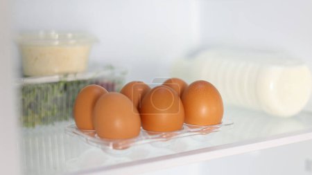 Photo for Fresh farm eggs in the fridge. High quality 4k footage - Royalty Free Image