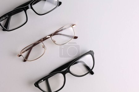 Photo for Glasses for vision correction on a light background with a place for text. High quality photo - Royalty Free Image