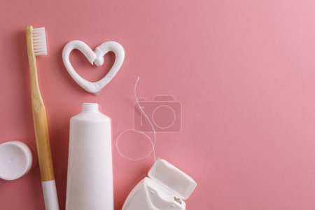 Photo for Toothpaste heart on a colored background. Dental care, oral health. High quality photo - Royalty Free Image