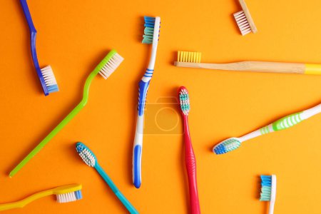 Photo for Different toothbrushes on a colored background. Dental care, oral health. High quality photo - Royalty Free Image