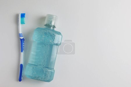 Photo for A mouthwash on a colored background. Dental care, dental health. High quality photo - Royalty Free Image