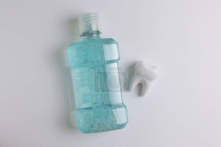 Photo for A mouthwash on a colored background. Dental care, dental health. High quality photo - Royalty Free Image