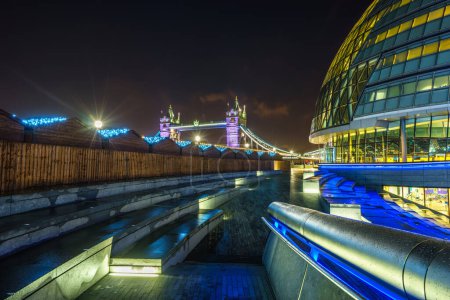 Photo for Tower Bridge and City Hall at night with Christmas lights in London, England - Royalty Free Image
