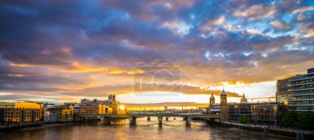 Photo for Southwark bridge at sunset in London, England - Royalty Free Image