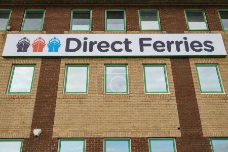 Photo for DOVER, UK -- 8 AUGUST,2016: Look up view of Direct Ferries logo on the building at the ferries port in Dover - Royalty Free Image