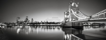 Black and white panorama of Tower Bridge and financial district of London. England