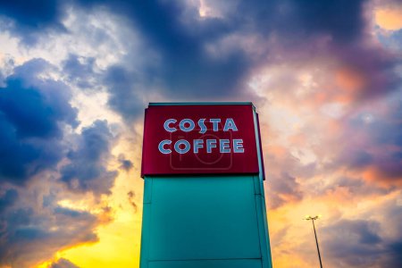 Photo for Stevenage, UK - July, 2019: Costa Coffee tower sign at Roaring Meg retail park in Stevenage. Costa Coffee is a British multinational coffeehouse company spread worldwide - Royalty Free Image