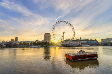 Photo for The London Eye at sunrise on the South Bank of the River Thames: London,England-October 2019 - Royalty Free Image