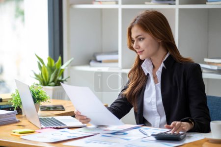 Photo for Successful happy smiling businesswoman saleswoman working on laptop computer, Young female making on video conference meeting online zoom, Accounting woman do taxes calculation interest rates law firm - Royalty Free Image