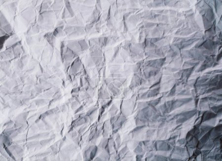 Abstract gray background with imitation of mountain landscape. Texture of crumpled paper
