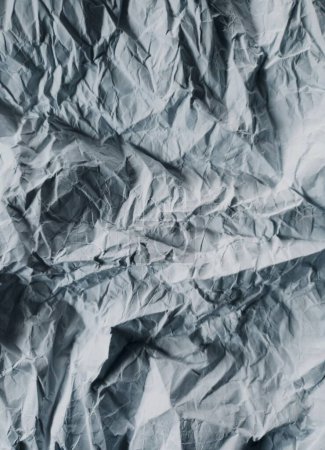 Abstract gray background with imitation of mountain landscape. Texture of crumpled paper