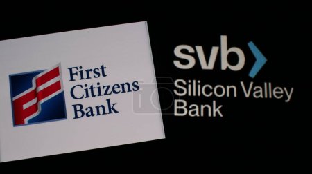 Photo for First Citizens bank logo with Silicon Valley Bank (SVB logo) in the background. - Royalty Free Image