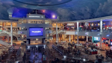 Photo for Trafford Centre food court seating area including all restaurants with large cinema screen,high quality stock image in Trafford ,Manchester England - Royalty Free Image