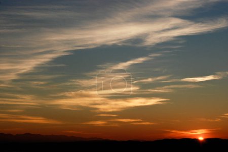 Photo for Hazy or smoky sunset over the south of Vancouver Island with the Olympic Peninsula in the distance. - Royalty Free Image