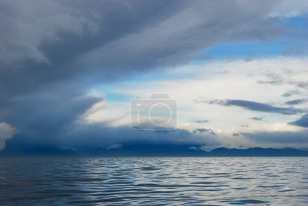 Photo for Reflections of storm clouds on a wavy but calm Juan De Fuca Strait near Victoria, BC - Royalty Free Image