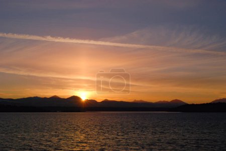 Photo for A beautiful sunset over the mountains of southern Vancouver Island as seen from Valdes Island - Royalty Free Image