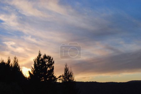 Photo for Sunset colours in the clouds as seen from a lookout in Gowland Todd Provincial Park, Vancouver Island, British Columbia, Canada - Royalty Free Image