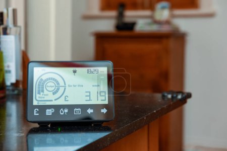 Photo for Smart energy meter in a home interior to monitor electricity usage in the house and reduce cost of living price - Royalty Free Image
