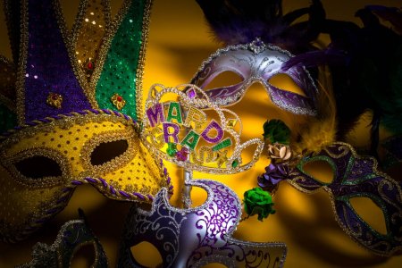 Photo for A colorful group of Mardi Gras masks on yellow background. High quality photo - Royalty Free Image