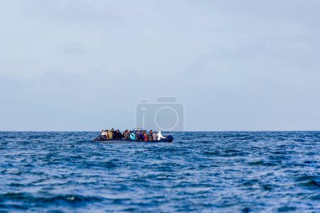 Photo for Migrants on a boat crossing the channel between france and UK heading towards the port of Dover. - Royalty Free Image