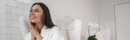 Photo for Woman in white bathrobe during medical procedure in beauty clinic. High quality photo - Royalty Free Image