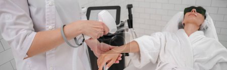 Photo for Hair removing procedure of hands. Laser epilation and cosmetology in beauty salon. High quality photo - Royalty Free Image