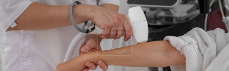 Photo for Hair removing procedure of hands. Laser epilation and cosmetology in beauty salon. High quality photo - Royalty Free Image