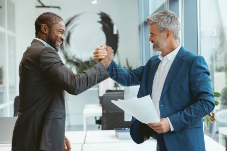 Foto de Business male partnership handshake. Successful deal after meeting - Imagen libre de derechos