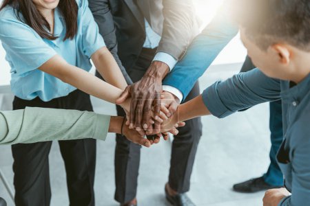 Téléchargez les photos : Group of coworkers stacked hands together as concept of corporate unity. High quality photo - en image libre de droit