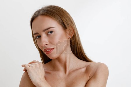 Photo for Tender woman with perfect skin over white studio background. High quality photo - Royalty Free Image