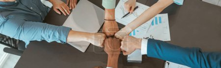 Photo for Group of coworkers stacked hands together as concept of corporate unity. High quality photo - Royalty Free Image